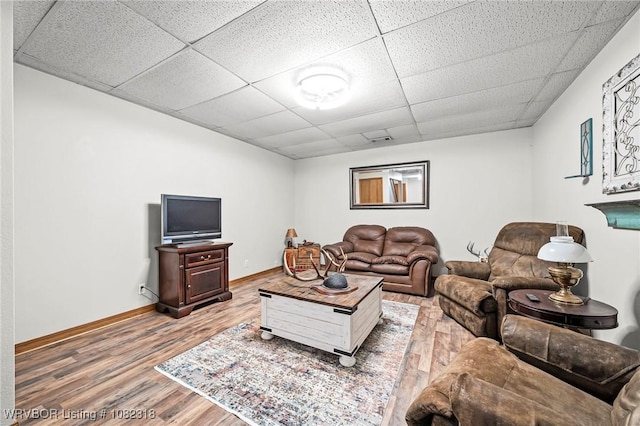106078 S 4715th Rd, Muldrow, OK 74948 - living room featuring a drop ceiling and wood finished floors