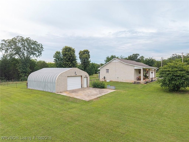 106078 S 4715th Rd, Muldrow, OK 74948 - view of grassy yard with a garage, an outdoor structure, and driveway