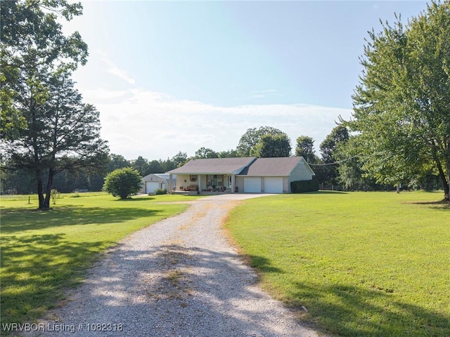 106078 S 4715th Rd, Muldrow, OK 74948 - ranch-style house with driveway, a front lawn, and an attached garage