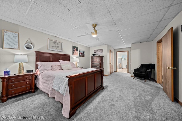 106078 S 4715th Rd, Muldrow, OK 74948 - carpeted bedroom featuring a drop ceiling, a ceiling fan, and ensuite bath