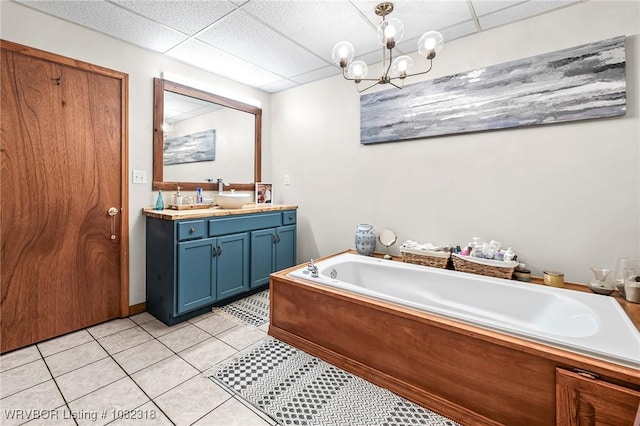 106078 S 4715th Rd, Muldrow, OK 74948 - full bathroom with double vanity, a drop ceiling, a bath, tile patterned floors, and a chandelier