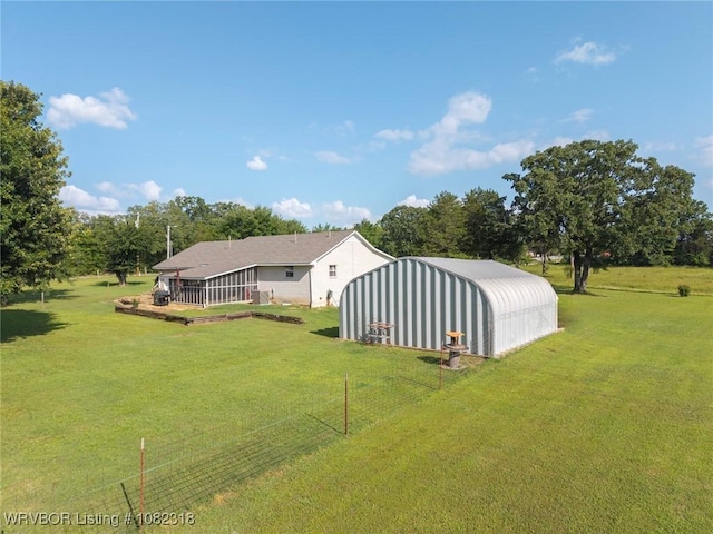 106078 S 4715th Rd, Muldrow, OK 74948 - view of green lawn with an outbuilding, a pole building, and view of wooded area