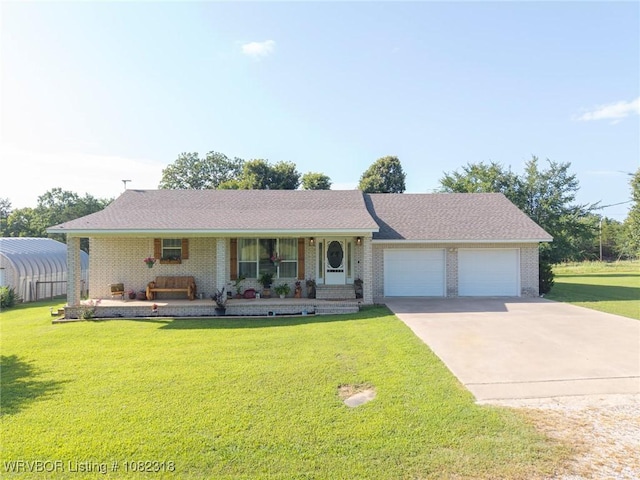 106078 S 4715th Rd, Muldrow, OK 74948 - ranch-style house with covered porch, a garage, brick siding, and driveway