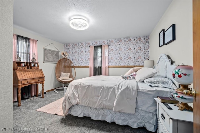 106078 S 4715th Rd, Muldrow, OK 74948 - carpeted bedroom featuring wallpapered walls, a textured ceiling, and a wainscoted wall