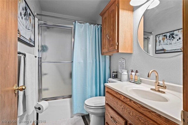 106078 S 4715th Rd, Muldrow, OK 74948 - bathroom featuring vanity, shower / bath combo with shower curtain, and a textured wall