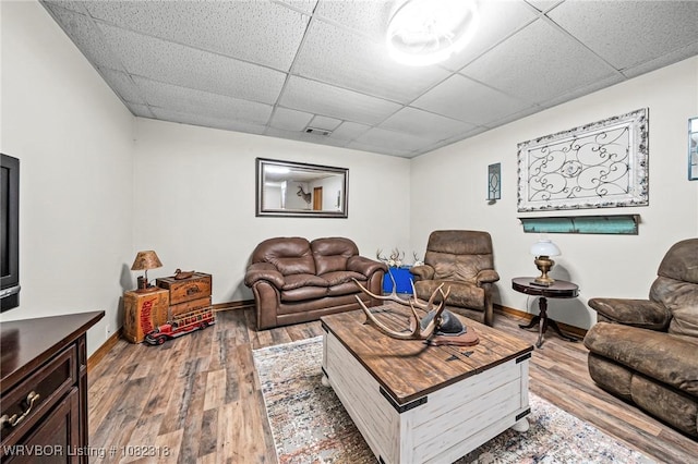 106078 S 4715th Rd, Muldrow, OK 74948 - living area with a drop ceiling and hardwood / wood-style floors