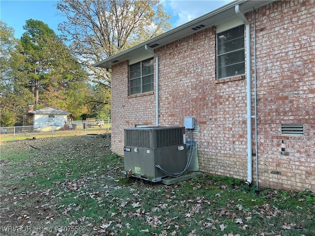 view of side of home featuring central AC