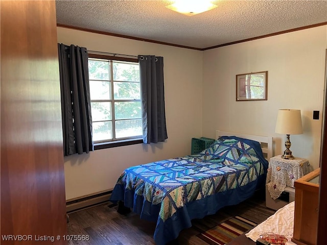 bedroom with a textured ceiling, a baseboard radiator, and dark hardwood / wood-style floors