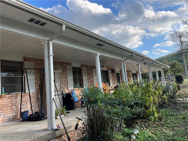 view of side of property featuring a porch