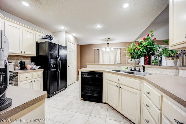 kitchen with pendant lighting, an inviting chandelier, black appliances, sink, and decorative backsplash