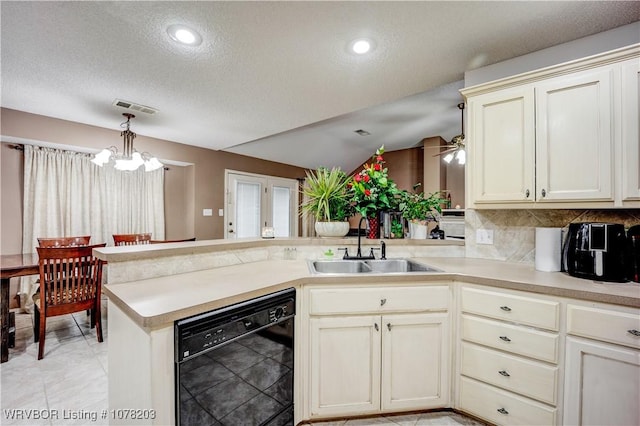 kitchen featuring kitchen peninsula, backsplash, sink, cream cabinets, and dishwasher