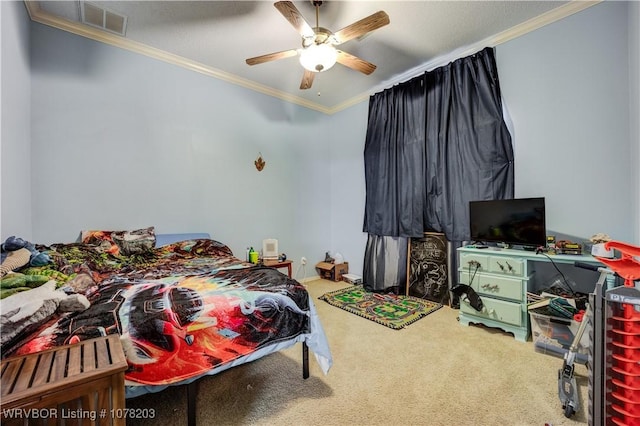 carpeted bedroom with ceiling fan and crown molding