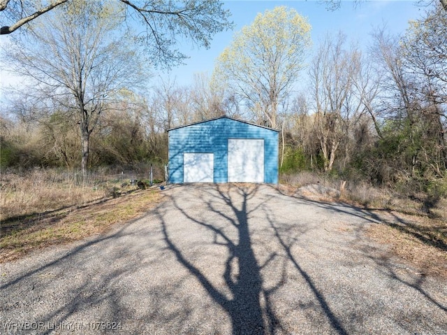 exterior space featuring aphalt driveway
