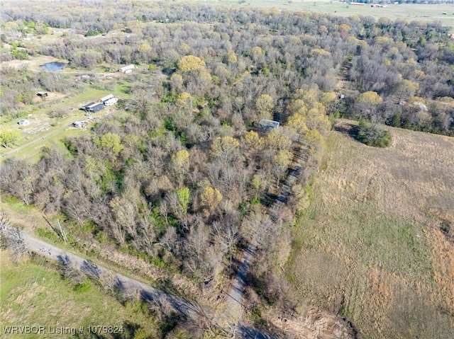 drone / aerial view with a view of trees