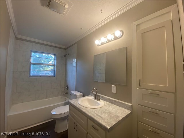 full bathroom featuring tiled shower / bath combo, toilet, crown molding, and vanity