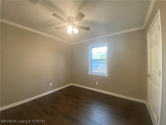 unfurnished room featuring ceiling fan, dark hardwood / wood-style floors, and ornamental molding