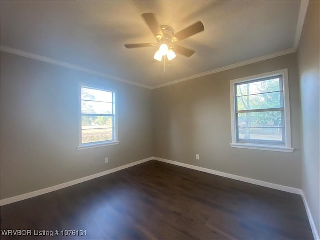 empty room featuring dark hardwood / wood-style floors, ceiling fan, and ornamental molding