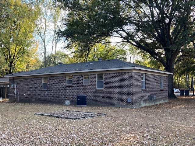 rear view of property with central air condition unit