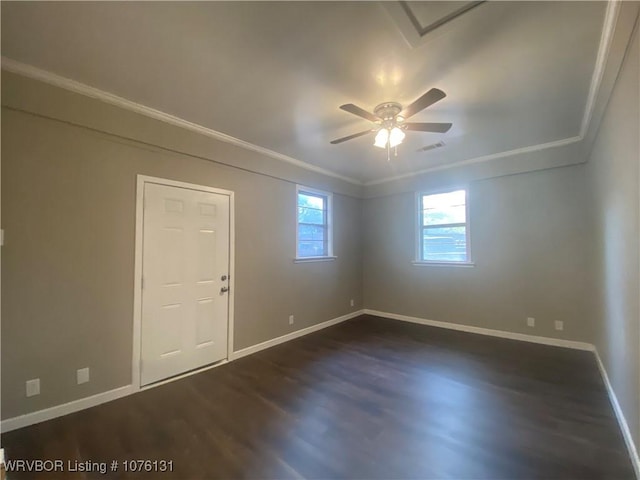 unfurnished room featuring dark hardwood / wood-style floors, ceiling fan, and crown molding