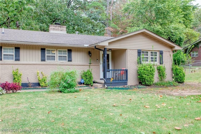 1326 56th Ter, Fort Smith, AR 72904 - single story home featuring brick siding, a front yard, a chimney, and roof with shingles