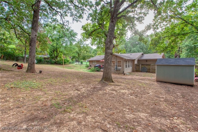 1326 56th Ter, Fort Smith, AR 72904 - view of yard with view of wooded area