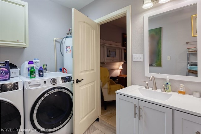 1326 56th Ter, Fort Smith, AR 72904 - washroom featuring separate washer and dryer and cabinet space