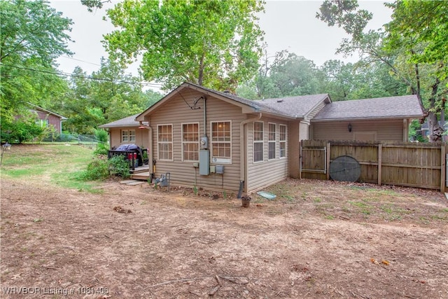 1326 56th Ter, Fort Smith, AR 72904 - rear view of property with a gate and roof with shingles