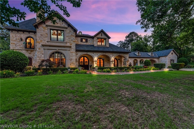 view of front of house with a yard