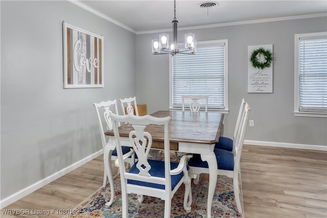3811 Dallas St, Fort Smith, AR 72903 - dining area with light wood-style floors, a chandelier, baseboards, and ornamental molding