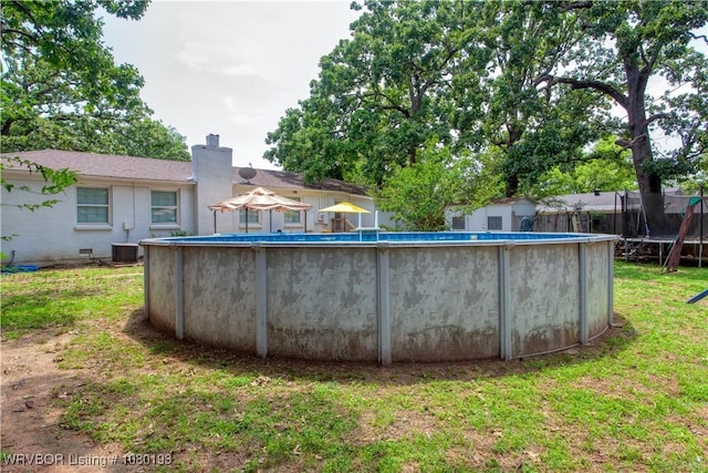 3811 Dallas St, Fort Smith, AR 72903 - view of swimming pool featuring a trampoline and central air condition unit