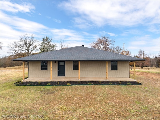 exterior space featuring a patio area and a lawn