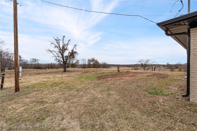 view of yard with a rural view