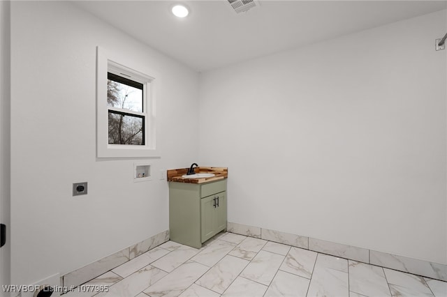 clothes washing area with sink, hookup for a washing machine, cabinets, and hookup for an electric dryer