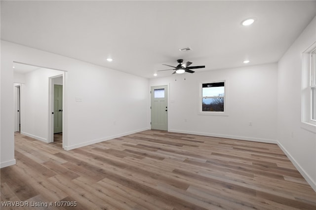 spare room featuring ceiling fan and light hardwood / wood-style floors