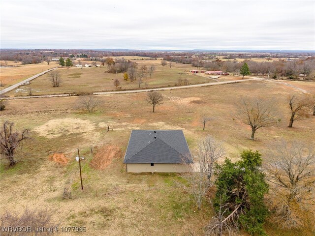 birds eye view of property with a rural view