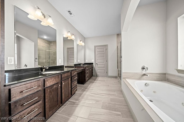 9205 R A Young Jr Dr, Fort Smith, AR 72916 - full bathroom featuring a shower stall, two vanities, and a jetted tub
