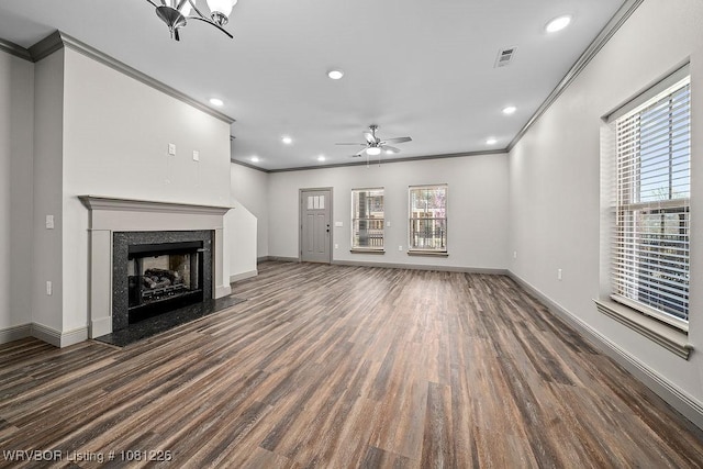 9205 R A Young Jr Dr, Fort Smith, AR 72916 - unfurnished living room featuring crown molding, wood finished floors, healthy amount of natural light, ceiling fan, and baseboards