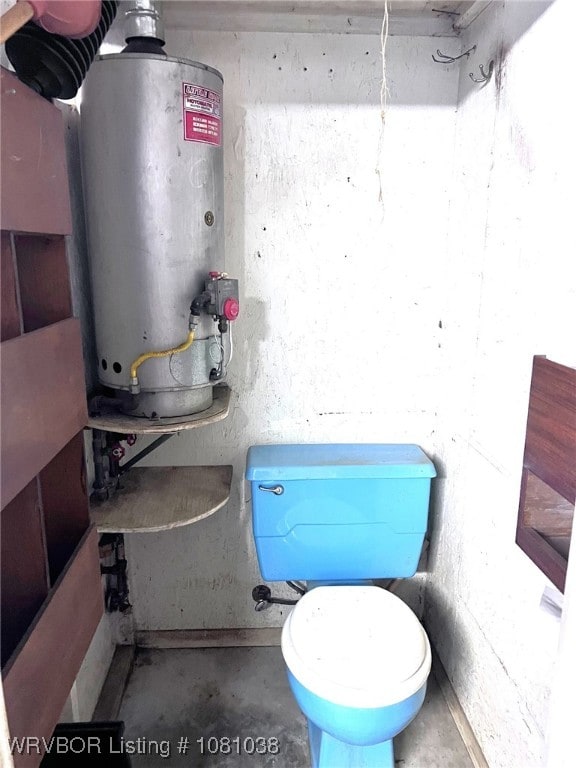 utility room featuring gas water heater