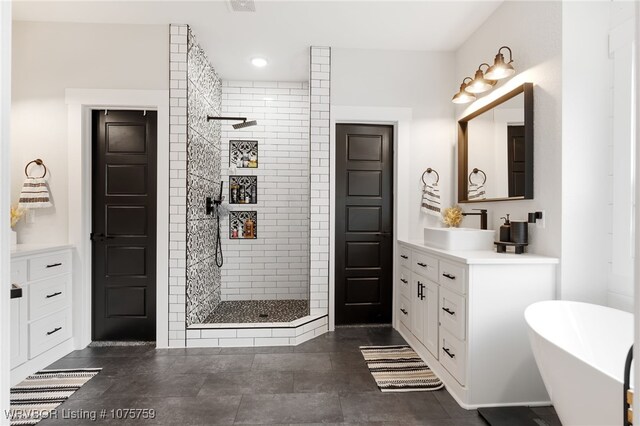 bathroom featuring vanity and plus walk in shower