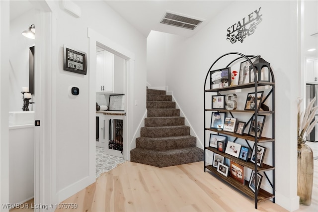 stairway with wood-type flooring