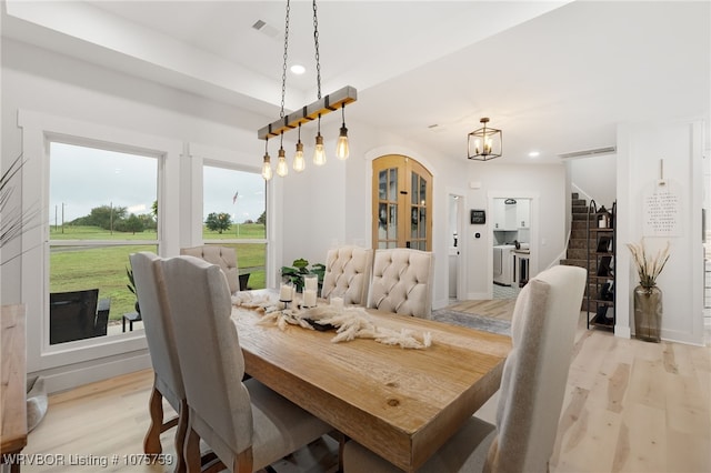 dining space with light hardwood / wood-style floors