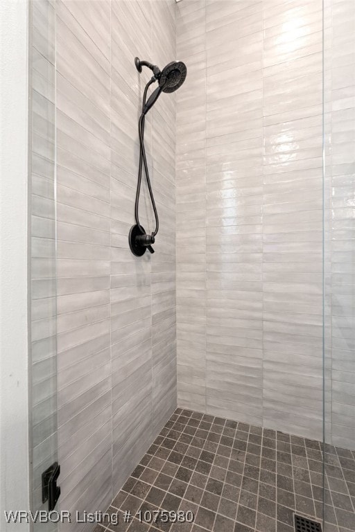 bathroom with a tile shower