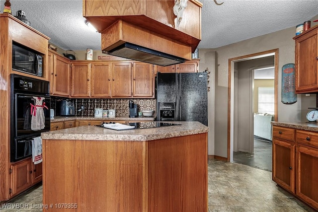 kitchen with brown cabinets, a warming drawer, decorative backsplash, a kitchen island, and black appliances