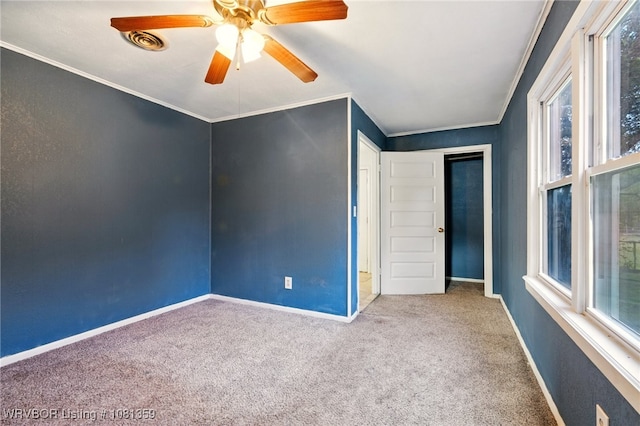 4002 57th St, Fort Smith, AR 72904 - unfurnished bedroom featuring carpet, multiple windows, crown molding, and ceiling fan