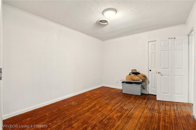 4002 57th St, Fort Smith, AR 72904 - spare room with wood-type flooring, crown molding, and a textured ceiling
