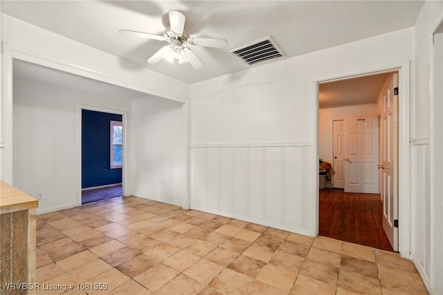4002 57th St, Fort Smith, AR 72904 - unfurnished room featuring a ceiling fan and a wainscoted wall