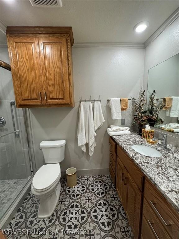 bathroom with tile patterned flooring, vanity, walk in shower, and crown molding