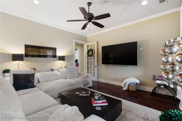 living room featuring dark wood-type flooring, ceiling fan, and crown molding