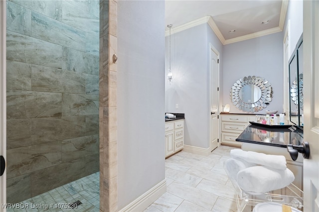 bathroom featuring vanity, a tile shower, and ornamental molding