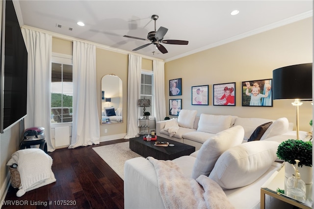 living room with dark hardwood / wood-style floors, ceiling fan, and crown molding